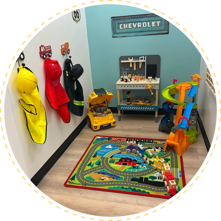 Children's playroom with colorful toys and racing-themed rug.